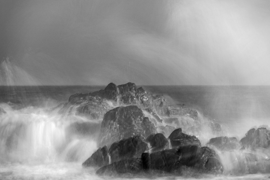 Salty spray plumes off the rocks at The Point, Mossel Bay.