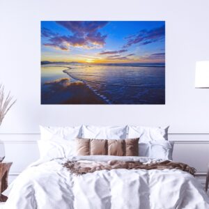 De Bakke Beach at low tide, the sun rising gently in the East.