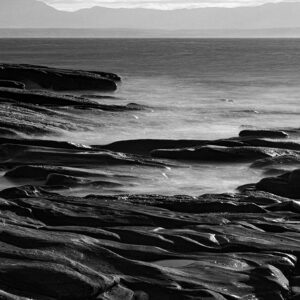 Saltwater glistens on the polished rocks of Mossel Bay.