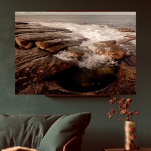 Tidal waters pour into a carved-out rock pool, Mossel Bay.