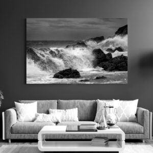 Waves pouring over weathered rocks at The Point, Mossel Bay.