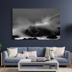 Waves create a graceful spray on the rocky outcrops of The Point, Mossel Bay.