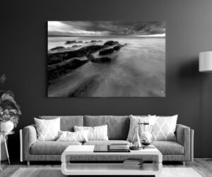 What lies beneath and beyond is left to the imagination as the sea courses its way over lines of rock, Mossel Bay.