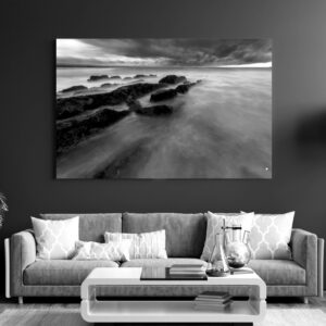 What lies beneath and beyond is left to the imagination as the sea courses its way over lines of rock, Mossel Bay.