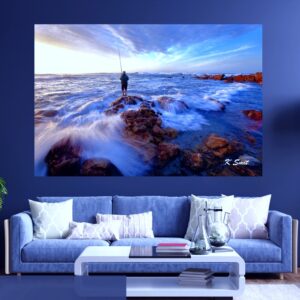 A fisherman finds some early morning action on the rocks at The Point, Mossel Bay.