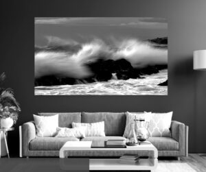 A wave crests the rocks at The Point, Mossel Bay, creating the illusion of a mohawk emerging from stone.