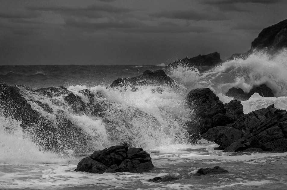Waves pouring over weathered rocks at The Point, Mossel Bay.