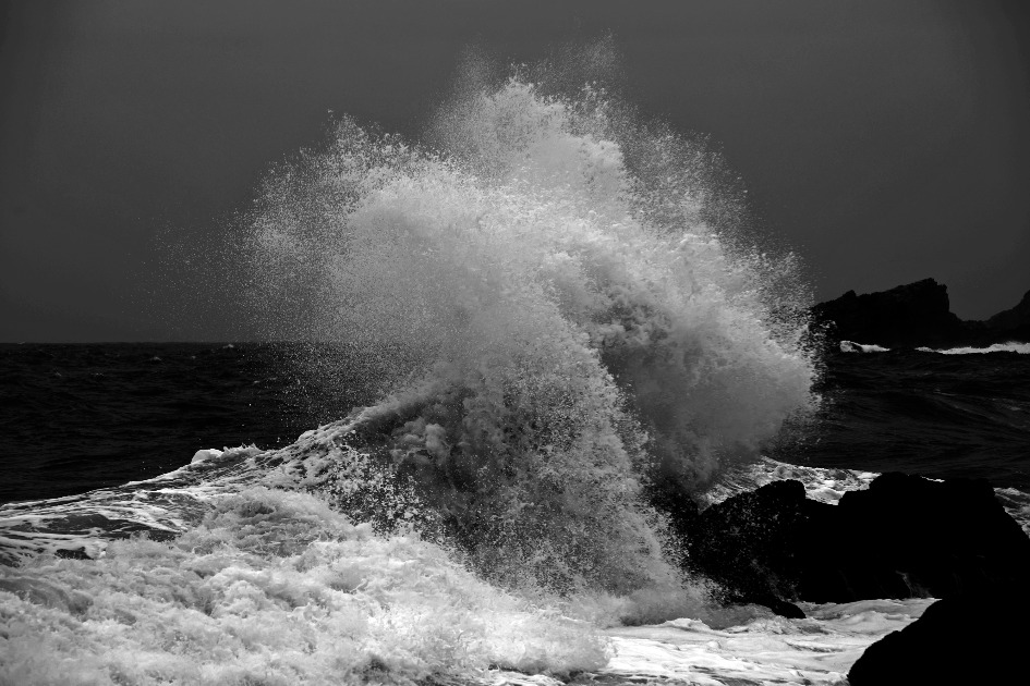 Open ocean waves crash and foam over the rocky coastline at The Point, Mossel Bay.