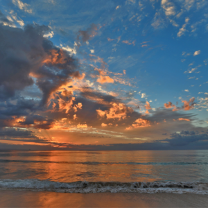 A captivating summer sunrise on Hartenbos Beach.