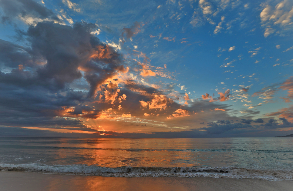 A captivating summer sunrise on Hartenbos Beach.