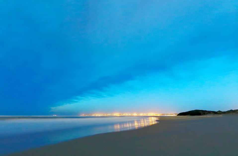 Mosselbay aglow at dusk, as seen from Klein Brak Beach.