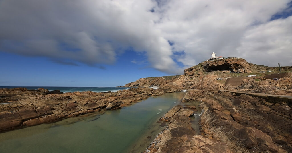 A sunny, wind-still day makes for a serene scene of the Cape St. Blaize Lighthouse in Mossel Bay.