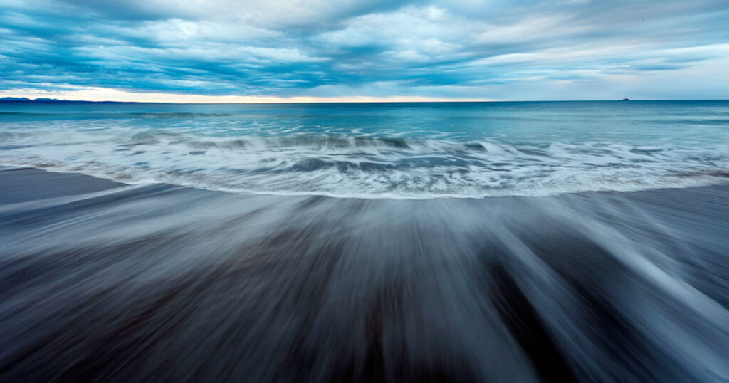A sweeping expanse of shoreline to sky at Klein Brak Beach.