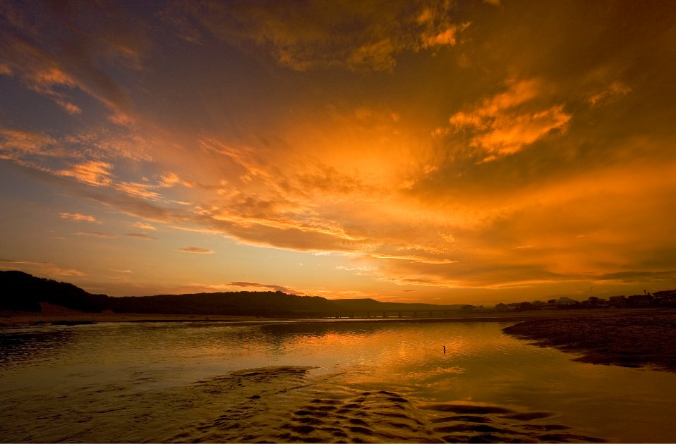 Klein Brak River mouth mirroring the sky at sunset.